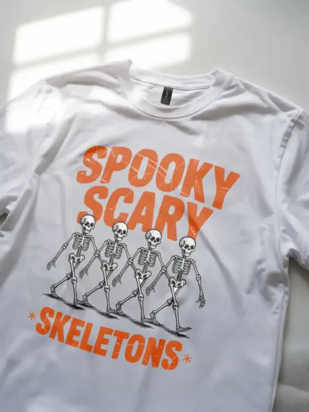 White angled front – retro horror white tee with spooky scary skeletons graphic