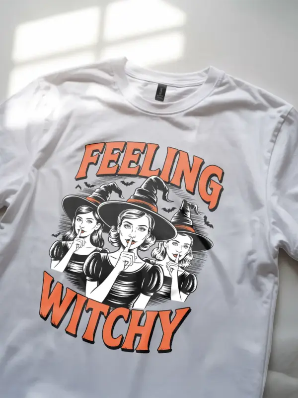 closeup of black and white witchcore illustration on white shirt