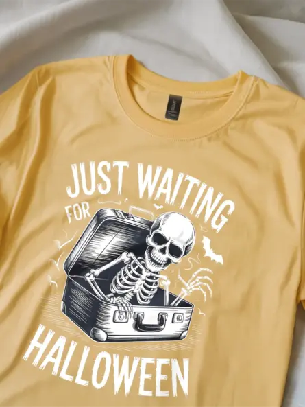 close-up – skeleton rising from suitcase on yellow spooky skeleton waiting for Halloween t-shirt