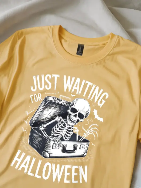 close-up – skeleton rising from suitcase on yellow spooky skeleton waiting for Halloween t-shirt
