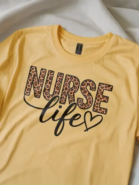 Lifestyle image of natural nurse life tee with heart and leopard design