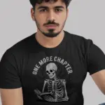 Black One More Chapter Shirt – Front View Skeleton Reading Book